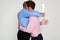 Two businessmen hugging