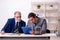 Two businessmen and meditation balls on the table