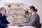 Two businessmen and meditation balls on the table