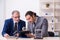 Two businessmen and meditation balls on the table