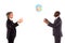 Two businessmen playing with a globe