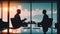 Two businessmen silhouettes negotiation in office across from panoramic window