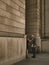 Two businessmen talking at entrance of monumental building