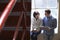 Two Businesspeople Having Informal Meeting On Office Stairs