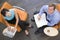 Two businesspeople sitting indoors having meeting