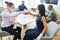 Two businesswomen doing a fist bump in the office