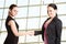 Two businesswomen shaking hands