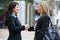 Two Businesswomen Shaking Hands Outside Office