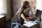 Two Businesswomen Working On Computer In Office