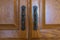 Two cabinet door handles side by side