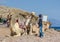 Two camels and local boys on coast of sea in Egypt Dahab South Sinai