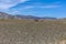 Two camels in steppe with mountains in the background. Altai, Mongolia