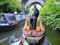 Two canal narrowboats passing each other