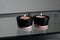 Two candles in black and pink concrete candle holders