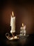 Two candlesticks with burning candles