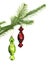 Two candy toys on conifer branch