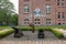 Two cannons by a flagpole at the German Naval Academy