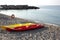 Two canoes on an empty beach on italian coast