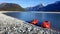 Two canoes parked by the side of a beautiful river