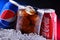 Two cans of world`s most popular soft drinks: Coke and Pepsi