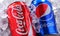 Two cans of world`s most popular soft drinks: Coke and Pepsi