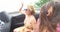 Two carefree girls partying while riding in cabriolet