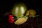 Two carnations, a military helmet and a pilots cap, a flask, against the background of the monument