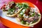 Two Carnitas Tacos on a Plate in Mexico City