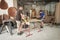 Two carpenters making furniture in a workshop