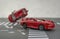 Two cars accident crash on road  insurance case, broken toys car