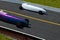 Two cars competing in a soap box derby race