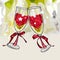 Two cartoon anniversary wine glasses filled with flowers clink