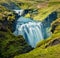 Two cascade waterfall on Skoga river. Sunny summer view from the tourist trek from famous Skogafoss waterfall to the top of the ri