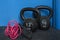 Two cast-iron kettlebells, of 12 and 16 kg, and skipping rope