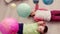 Two caucasian kids lying on a floor playing with a spaceship toy rocket, looking at colorful planets hanging above them