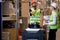 two caucasian men workers doing stocktaking of products on shelves in warehouse