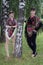 Two caucasian slavonic women standing near the birch tree