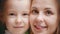 Two caucasian women - mother and daughter - smiling
