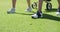 Two caucasian women playing golf carrying bag filled with golf clubs