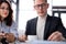 two caucasian workers at meeting in restaurant. portrait of handsome guy in suit talking