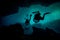 Two Cave Divers Blurred in Halocline in a Cenote