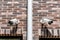 Two cctv surveillance security system cameras on the brick wall of luxury residential building for safety