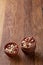 Two ceramic bowls with raw peanuts mix isolated over rustic wooden backround, top view, close-up.