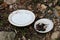 Two ceramic painted plates thrown as garbage in nature