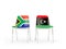 Two chairs with flags of South Africa and libya isolated on white