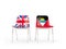 Two chairs with flags of United Kingdom and antigua and barbuda isolated on white