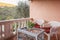 Two chairs with a table on the terrace overlooking the mountains