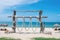 Two Chairs Under Parasol In Tropical Beach