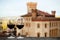 Two chalices of wine with the castle of Barolo Italy