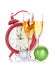 Two champagne glasses, christmas decor and clock